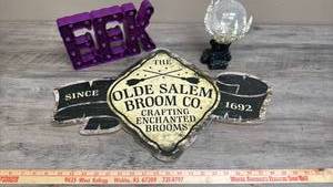 lot 517 image: Olde Salem Broom Co. 1692 Sign, EEK lighted sign, Skeleton hands with crystal ball