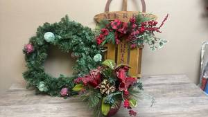 lot 541 image: Christmas Decoration Set Wreath, Swag Basket Centerpiece with Ornaments and Hanging decorative Sled that says Merry Christmas