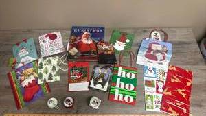 lot 545 image: Holiday Gift Bags, miniature Mickey Mouse Snow Globes from 2002, 2003, and 2004 and The Night Before Christmas Book.