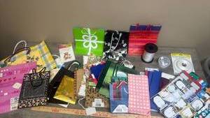 lot 569 image: Gift Bags, Ribbon, and Wrapping Paper Supplies Bundle
