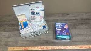lot 578 image: First Aid Kit with ABD Pads, Ankle Support, Bandages and Medical Supplies
