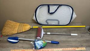 lot 599 image: Collapsible laundry basket, broom, sticky roller, and long handled scrubber with an extra scrub head new in package