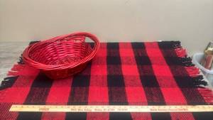 lot 605 image: Red Woven Basket with Handles and Red and Black Checkered Rug