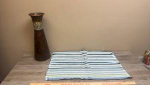 lot 606 image: Decorative Tapered Metal Vase with Textured Band and Striped Woven Textile Rug