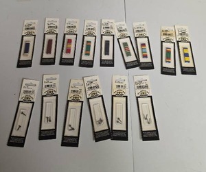 lot 332 image: IRA Green Inc Lot of Military Ribbon Bars and Insignia Fasteners