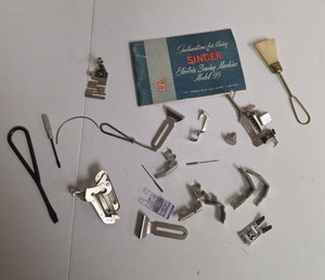 lot 333 image: Singer Model 99 Electric Sewing Machine Accessories and some sewing tools