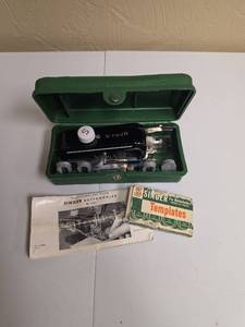 lot 334 image: Vintage Singer Buttonholer No. 160506 with Templates and Original Instruction manual