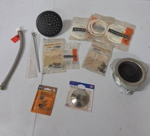 lot 858 image: Plumbing Parts Lot - DeVilbiss Rubber Rings, Delta Shower Head, Sink Drain Fitting and more