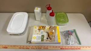 lot 453 image: Kitchen Lot - Storage Container, Squeeze Condiment Bottles, Stir Sticks, Wilson Disposable Counter covers, and a bag of chip clips