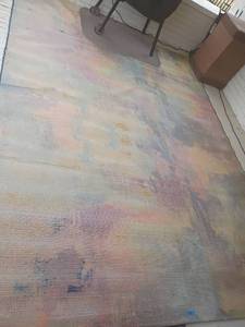 lot 933 image: Outdoor Rug. Worn in some areas.  See pictures. 10ft. 10in X 8ft 1in.