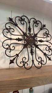 lot 1002 image: Metal decorative wall decor 24 inches in diameter