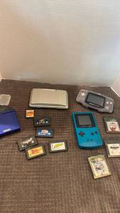 lot 1104 image: Game boy color, advancesp and DS with games one hinge is broken on ds no chargers