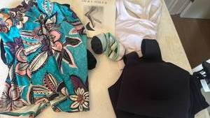 lot 1265 image: Swim suit bra sized 34e, socks, sports bras xl