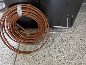 lot 2016 image: Roll of Tubing and Rack for Blower