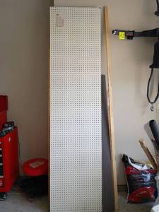 lot 2020 image: Scrap Wood with Peg Board.   Peg Board is 2ft. X 8ft.