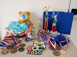 lot 2125 image: Trophies, Medals, Stuffed Bear, Graduation Caps, Stickers and Reusable Bags