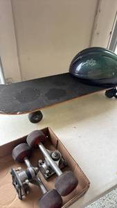 lot 2335 image: Skateboard, helmet and extra wheels