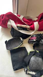 lot 2336 image: Knee and elbow pads with bag