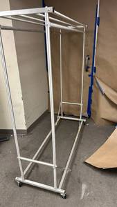lot 70814 image: 5 foot Double sided Metal Clothing Rack with Top Rod and Casters