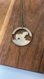 lot 102 image: United States of America One Dollar Cutout Pendant Necklace