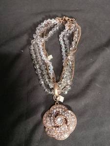 lot 7139 image: Multi-Strand Beaded Necklace with Rose Gold Circular Pendant