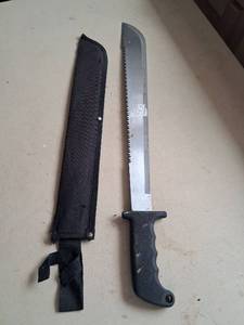 lot 67 image: Machete with Serrated Blade and Sheath Approximately 18 inch