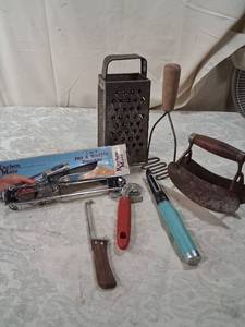 lot 83 image: Vintage Kitchen Tools Lot Box Grater, Mashers, Jar Opener, Egg Beater, Peeler