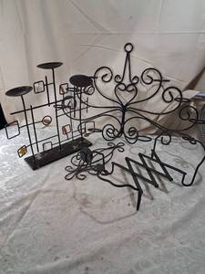 lot 194 image: Black Metal Candle Holder and Decorative Metal Lot with Scroll Wall Piece and Accordion Rack