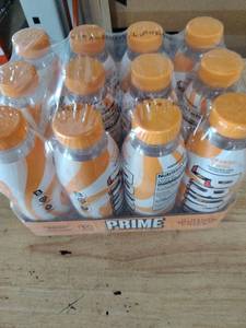 lot 1015 image: Prime Orange Energy Drink Beverage 12-Pack Lot