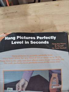 lot 1277 image: Picture Hanging Tool with Level 50 Standard #17 Nails 10 lb Capacity