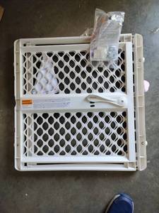 lot 1354 image: White plastic baby safety gate with hardware approximately 26x25 in