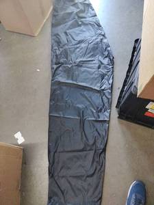 lot 2333 image: Black kayak cover approximately 102 in Long