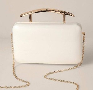 lot 4479 image: Small plastic clutch with gold handle and chain