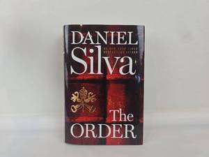 lot 11 image: The Order by Daniel Silva Hardcover Book