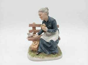 lot 285 image: Porcelain Figurine Elderly Woman on Bench KW764