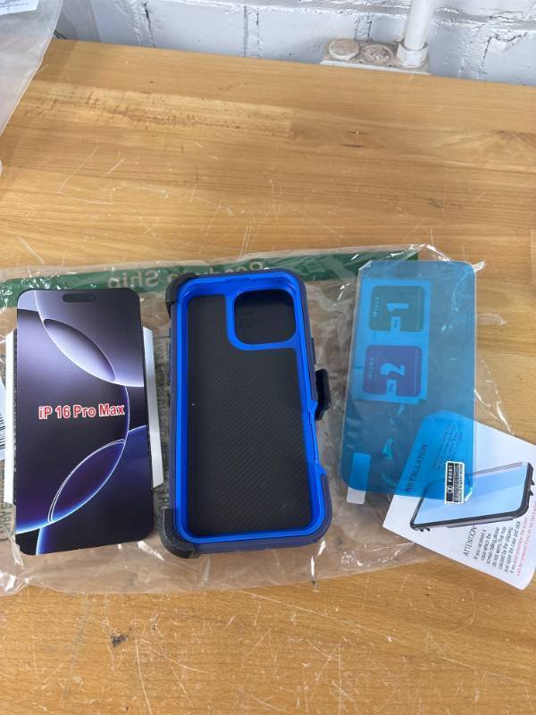 lot 2096 image: iPhone 16 Pro Max hard case with belt clip and screen protector