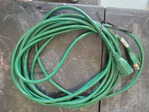 lot 9 image: Green Extension Cord with Outlet Adapter - Retail $0