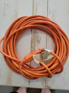 lot 16 image: Orange Extension Cord with Label - Retail $0