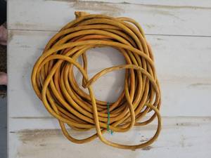 lot 17 image: Yellow extension cord - Retail $0
