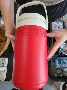 lot 66 image: Coleman Red and White Insulated Beverage Cooler with Handle - Retail $0