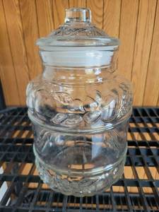 lot 108 image: Glass Jar with glass Lid Ornamental Design - Retail $0