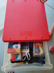 lot 113 image: Little Tikes Storage Container with Medical Support Braces and Accessories - Retail $0