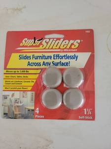 lot 123 image: Waxman Slift Sliders 1 14 inch Self-Stick Furniture Sliders 4 Pieces 7002 - Retail $0