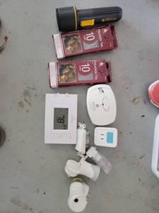 lot 152 image: Mixed Lot Eveready Flashlight Emerson Thermostat First Alert CO Detector Adjustable Ties Plug Adapters - Retail $0