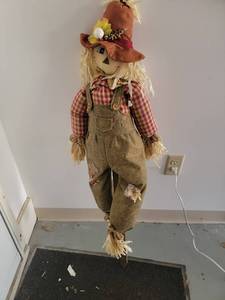 lot 157 image: Handmade Scarecrow yard stake decoration with Straw Hair, Gingham Shirt, Overall Pants  - Retail $0