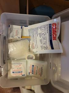 lot 647 image: Johnson & Johnson First Aid Kit with Coach Instant Cold Pack and Nu Gauze Dressings no bandaids