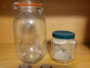 lot 652 image: Glass Storage Jars with Lids Set of 2