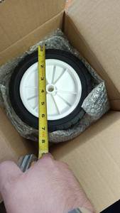 lot 38 image: Lawn Mower Wheels 8 Inch Diameter White Rim Black Tire