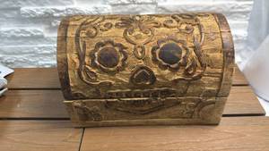 lot 9 image: Carved Wood Dome-Top Trunk with Skull Design & Ornamental Hardware