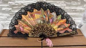 lot 62 image: Decorative 18 Hand Fan with Black Lace Edging and Painted Canvas Panel